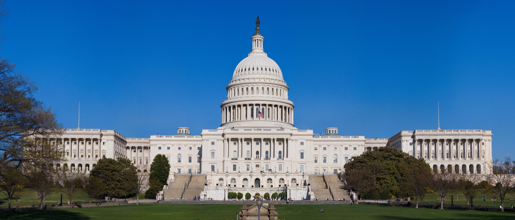 The west front of the United States Capitol under a clear blue sky