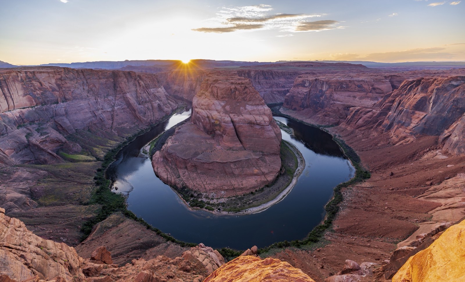 The Colorado River curving through Horseshoe Bend in Arizona at sunset